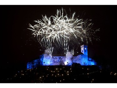 Fireworks explode above Ljubljana castle during New Year's celebrations just after midnight in Ljubljana, Slovenia on January 1, 2018.