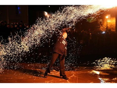 Residents celebrate the New Year by swinging fireballs above their heads as they walk through the town of Stonehaven, on the north east coast of Scotland on January 1, 2018. The tradition dates back over 100 years and begins at the stroke of midnight every New Years Eve.