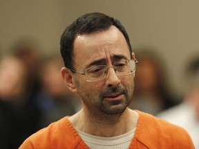 Dr. Larry Nassar appears in court for a plea hearing in Lansing, Mich., Wednesday, Nov. 22, 2017.