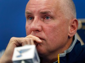 St. Louis Blues GM Doug Armstrong pauses while answering a question during a news conference on Feb. 1, 2017