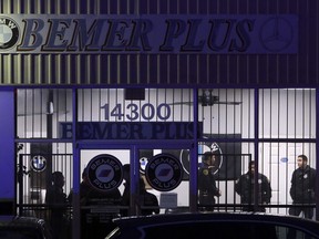 Houston Police Department officers investigate a double murder and suicide scene at 14300 South Post Oak Road on Friday, Dec. 29, 2017, in Houston.Police say a man walked into a Houston auto shop where he used to work and fatally shot two people before going outside and killing himself. The man, whose name wasn't immediately released, entered Bemer Plus about 4 p.m. Friday. The shop specializes in used BMW sales and repairs.