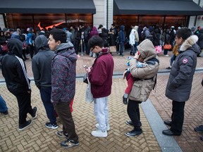 As shoppers search for the best post-Christmas deals, a study by the University of British Columbia has found bargain hunters tend to treat customer-service staff as less human as compared with those who aren't looking for a good deal. People wait in a lineup to get into a Nike store during Boxing Day sales at the McArthur Glen Designer Outlet mall, in Richmond, B.C., on Tuesday, December 26, 2017.