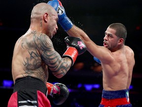 Sadaam Ali punches Miguel Cotto during their bout at Madison Square Garden on December 2, 2017 in New York City.