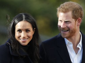 FILE - In this Dec. 1, 2017 file photo, Britain's Prince Harry and his fiancee Meghan Markle arrive at Nottingham Academy in Nottingham, England. Prince Harry's fiancee is set to join Britain's royal family for Christmas. Kensington Palace says Meghan Markle will join Queen Elizabeth II and other senior royals at Sandringham, a sprawling estate in Norfolk, 110 miles (175 kilometers) north of London, it was announced on Wednesday, Dec. 13, 2017.