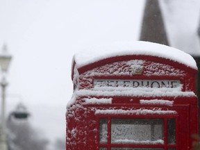 A snow covered phone box in Marlow, England, after heavy snow fell across parts of the UK, Sunday Dec. 10, 2017.
