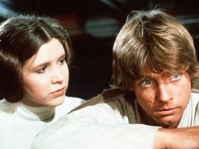 Carrie Fisher as Princess Leia and Mark Hamill as Luke Skywalker in Star Wars. [PNG Merlin Archive]