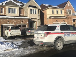 Police are pictured at a home in Vaughan's Bathurst St.-Teston Rd. area where a hostage taker was believed to have lived.