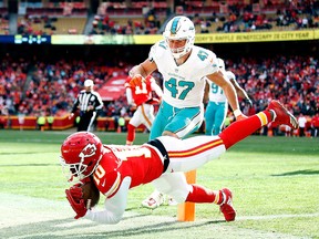Wide receiver Tyreek Hill of the Kansas City Chiefs fails to get both feet in bounds in the endzone as middle linebacker Kiko Alonso of the Miami Dolphins defends during the game at Arrowhead Stadium on Dec. 24, 2017 in Kansas City, Mo.  (Jamie Squire/Getty Images)