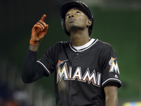 Miami Marlins' Dee Gordon points to the sky during a game against the New York Mets on Sept. 26, 2017
