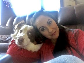 In this undated photo provided by Lindsy Bray, Bray is shown with her Australian Shepherd named Dexter.