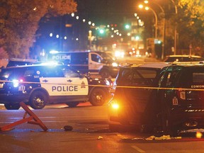 Police investigate the scene where a car crashed into a roadblock in Edmonton on Sept.30, 2017. THE CANADIAN PRESS/Jason Franson