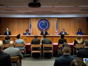 FCC chairman Ajit Pai and commission members take their seats for a hearing at the FCC on Dec. 14, 2017 in Washington, D.C.  (BRENDAN SMIALOWSKI/AFP/Getty Images)