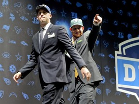 In this April 28, 2016, file photo, Los Angeles Rams' Jared Goff, left, and Philadelphia Eagles' Carson Wentz, greet fans at Selection Square in Grant Park after the quarterbacks were selected No. 1 and No. 2, respectively, in the NFL football draft in Chicago. The coolest of matchups this weekend has Goff and Wentz facing each other on Sunday. Both have matured rapidly, sparking turnarounds that could lead to, well, the Super Bowl. (AP Photo/Matt Marton, File)