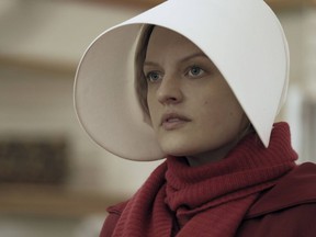 This image released by Hulu shows Elisabeth Moss as Offred in a scene from the critically acclaimed, "The Handmaid's Tale." .