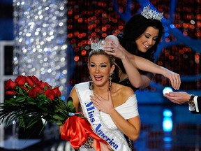 Miss America 2012 Laura Kaeppeler crowns Mallory Hytes Hagan of New York, the new Miss America during the 2013 Miss America Pageant at PH Live at Planet Hollywood Resort & Casino on Jan.12, 2013 in Las Vegas. (Photo by David Becker/Getty Images)