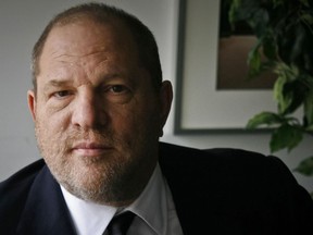 In this Nov. 23, 2011 file photo, film producer Harvey Weinstein poses for a photo in New York. Six women filed a federal lawsuit against Weinstein on Wednesday, Dec. 6, 2017, claiming that the movie mogul's actions to cover up assaults amounted to civil racketeering.