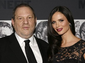 FILE - In this Dec. 3, 2012 file photo, producer Harvey Weinstein, left, and his wife, fashion designer Georgina Chapman attend the Museum of Modern Art Film Benefit Tribute to Quentin Tarantino in New York.