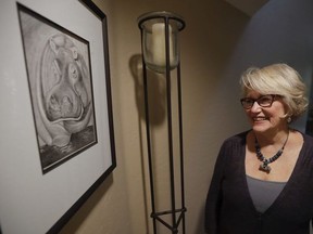 Gayla Peevey, singer of that enduring Christmas classic, "I Want a Hippopotamus For Christmas," stands next to an image she drew of a hippopotamus in her home Wednesday, Dec. 14, 2016, in La Mesa, Calif.