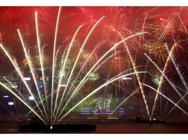 Fireworks explode over the Victoria Harbor during New Year's Eve to celebrate the start of year 2018 in Hong Kong, Monday, Jan. 1, 2018.