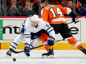 Toronto Maple Leafs forward Zach Hyman battles for the puck against the Philadelphia Flyers on Dec. 12, 2017