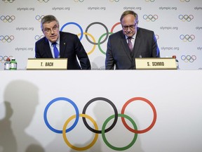 IOC President Thomas Bach, left, and Samuel Schmid, President of the IOC Inquiry Commission take their seats as they arrive for a press conference after an Executive Board meeting, in Lausanne, Switzerland, Tuesday, Dec. 5, 2017.