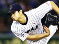 In this Nov. 19, 2015, file photo, Japan's starter Shohei Otani pitches against South Korea during the first inning of their semifinal game at the Premier12 world baseball tournament at Tokyo Dome in Tokyo. A person familiar with the decision says Major League Baseball owners on Friday, Dec. 1, 2017, have approved a new posting agreement with their Japanese counterparts in a move that allows bidding to start for coveted pitcher and outfielder Shohei Ohtani.   The person spoke on condition of anonymity because no announcement had been made. (AP Photo/Shizuo Kambayashi, File)