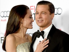 Angelina Jolie Pitt (L) and Brad Pitt arrive at the AFI FEST 2015 opening night gala premiere of Universal Pictures' "By The Sea" at the Chinese Theatre on Nov. 5, 2015 in Los Angeles.  (Kevin Winter/Getty Images)