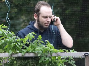 Freed Canadian hostage Joshua Boyle talks on the phone outside the Boyle family home in Smiths Falls, Ont., October 14, 2017.