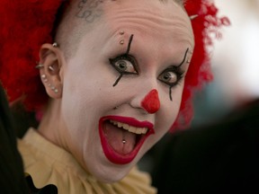 A Juggalo shows her makeup and smile during day two of the Insane Clown Posse Juggalo Weekend held at the Marquee Beer Market in Calgary on April 8, 2017. (Jim Wells//Postmedia Network)