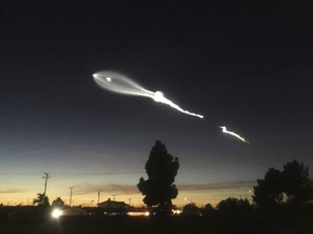 In this photo provided by Javier Mendoza, the contrail from a SpaceX Falcon 9 rocket is seen from Long Beach, Calif., more than 100 miles southeast from its launch site Vandenberg Air Force Base, Calif., on Friday, Dec. 22, 2017. A reused SpaceX rocket has carried 10 satellites into orbit from California, leaving behind it a trail of mystery and wonder as it soared into space. The Falcon 9 booster lifted off from coastal Vandenberg Air Force Base, carrying the latest batch of satellites for Iridium Communications.