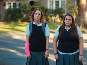 This file image released by A24 Films shows Saoirse Ronan, left, and Beanie Feldstein in a scene from "Lady Bird." Ronan says she hopes that her latest film “Lady Bird” helps people to feel understood in the same way HBO show “Girls” helped her. Her performance has earned her some of the best reviews of her career and could result in a third Oscar nomination for the 23-year-old Irish actress. (Merie Wallace/A24 via AP, File)