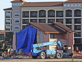 This photo taken May 26, 2016, shows new constructions around the townhouse of an 81-year-old widow that refuses to sell home to Westgate Resorts in Orlando.