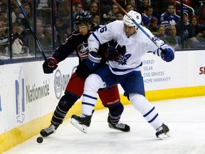 Toronto Maple Leafs defenseman Roman Polak, right, collides with Columbus Blue Jackets forward Sonny Milano on Dec. 20, 2017