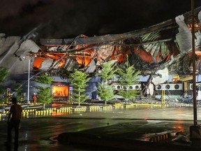 This photo taken on Dec. 23, 2017 shows firefighters extinguishing a fire at a shopping mall in Davao City on the southern Philippine island of Mindanao. 
(MANMAN DEJETO/AFP/Getty Images)