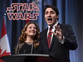 Prime Minister Justin Trudeau and his wife Sophie Gregoire Trudeau speak at the National Liberal Caucus Holiday Party in Ottawa on Wednesday, Dec. 13, 2017.