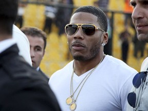In this March 13, 2015, file photo, rapper Nelly approaches the stage for a concert in Irbil, northern Iraq.