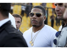 In this March 13, 2015, file photo, rapper Nelly approaches the stage for a concert in Irbil, northern Iraq. Prosecutors in Washington state say they cannot proceed with a rape case against the rapper Nelly because the accuser is not cooperating. The woman said Nelly raped her on his tour bus in October in a Seattle suburb, and police arrested him. Prosecutors said Thursday, Dec. 14, 2017, that they've reviewed the investigation, but without the woman's help, they can't move forward with the case.