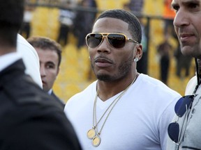 FILE- In this March 13, 2015, file photo, rapper Nelly approaches the stage for a concert in Irbil, northern Iraq. Prosecutors in Washington state say they cannot proceed with a rape case against the rapper Nelly because the accuser is not cooperating. The woman said Nelly raped her on his tour bus in October in a Seattle suburb, and police arrested him. Prosecutors said Thursday, Dec. 14, 2017, that they've reviewed the investigation, but without the woman's help, they can't move forward with the case.