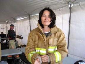 Liane Tessier, a former firefighter, says her 12-year battle against "systemic" gender discrimination has ended with a settlement that will see a public apology issued by the city of Halifax during a news conference on Monday.