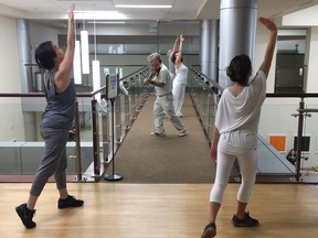 Violinist Anthony Hyatt leads dancers through MedStar Georgetown University Hospital in Washington on Oct. 11, 2017. Musicians and dancers are part of the Georgetown Lombardi Comprehensive Cancer Center's arts and humanities program.