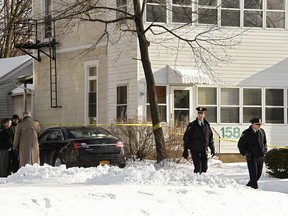 Troy police investigate multiple deaths at 158 Second Ave. on Tuesday, Dec. 26, 2017, in Troy, N.Y.  (Lori Van Buren/The Albany Times Union via AP)