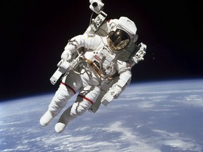This Feb. 7, 1984 photo made available by NASA shows astronaut Bruce McCandless II, participating in a spacewalk a few metres away from the cabin of the Earth-orbiting space shuttle Challenger, using a nitrogen-propelled Manned Maneuvering Unit.