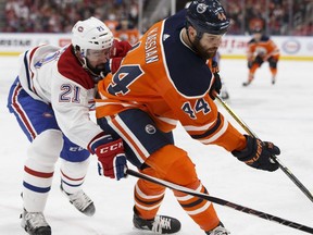 Edmonton's Zack Kassian (44) battles Montreal's David Schlemko (21) during the first period of a NHL game between the Edmonton Oilers and the Montreal Canadiens in Edmonton, Alberta on Saturday, December 23, 2017.