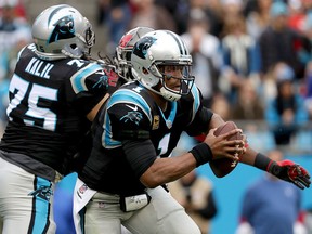 Cam Newton of the Carolina Panthers runs with the ball against the Tampa Bay Buccaneers during their game at Bank of America Stadium on Dec. 24, 2017 in Charlotte, N.C. (Streeter Lecka/Getty Images)