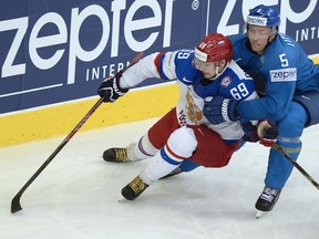 Alex Burmistrov in action for Russia at the 2014 World Ice Hockey Championships.