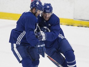 Patrick Marleau tries to get outside of Nazem Kadri during Maple Leafs practice in Toronto on Dec. 5, 2017