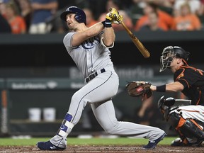 In this Sept. 22, 2017, file photo, Tampa Bay Rays' Evan Longoria follows through on a solo home run against the Baltimore Orioles in the third inning of a baseball game, in Baltimore.
