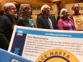 Bernie Sanders (centre) and other members of the anti-NAFTA left attend a news conference on Capitol Hill in Washington, D.C., Wednesday, Dec. 13, 2017.