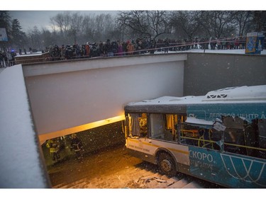 Rescuers work at the scene of a bus crash in Moscow, Russia, Monday, Dec. 25, 2017. (AP Photo/Ivan Sekretarev)