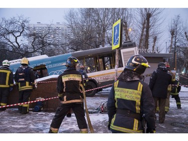 Rescuers work at the scene of a bus crash in Moscow, Russia, Monday, Dec. 25, 2017.  (AP Photo/Ivan Sekretarev)